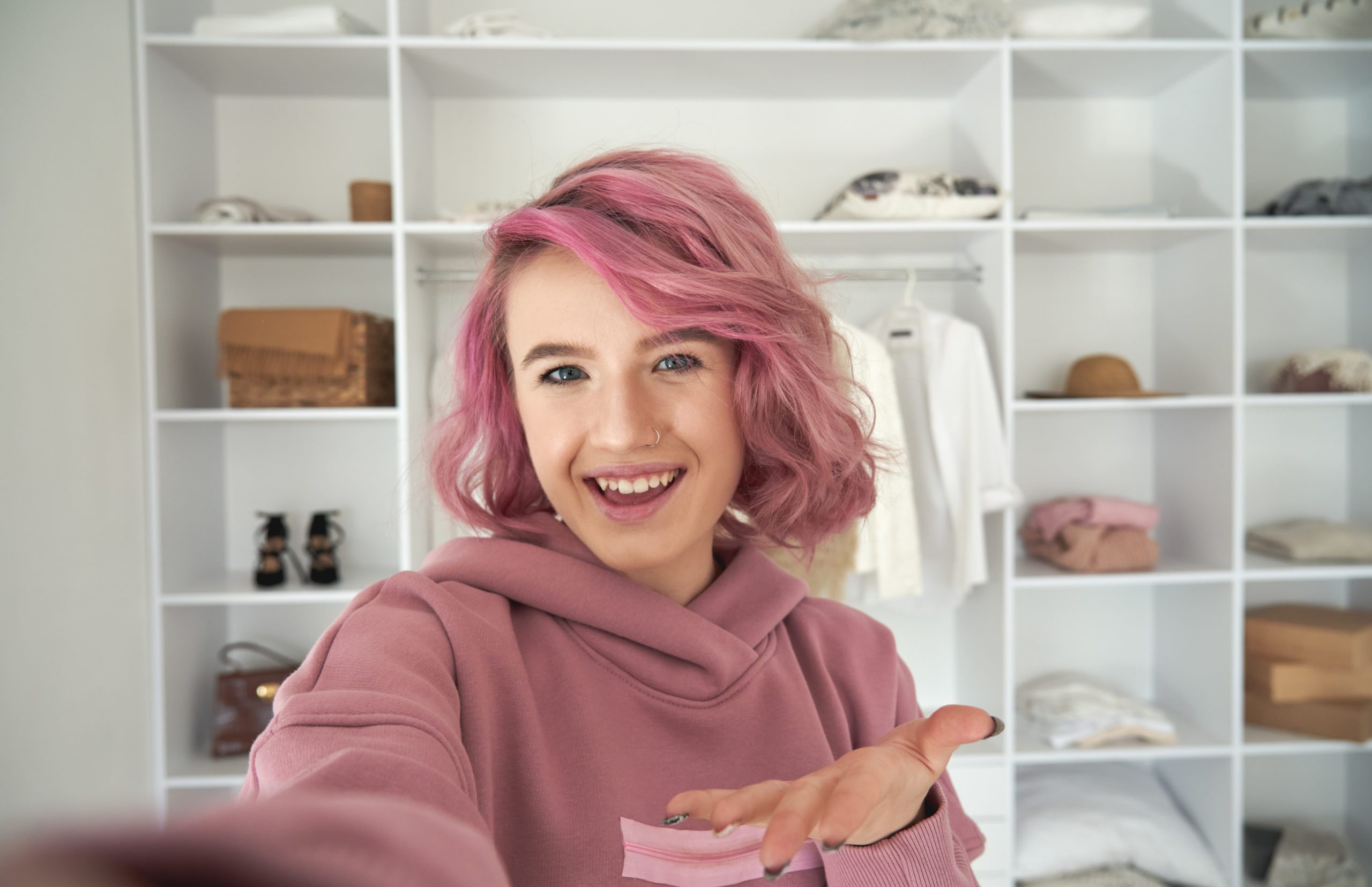 Happy hipster teen girl recording video message