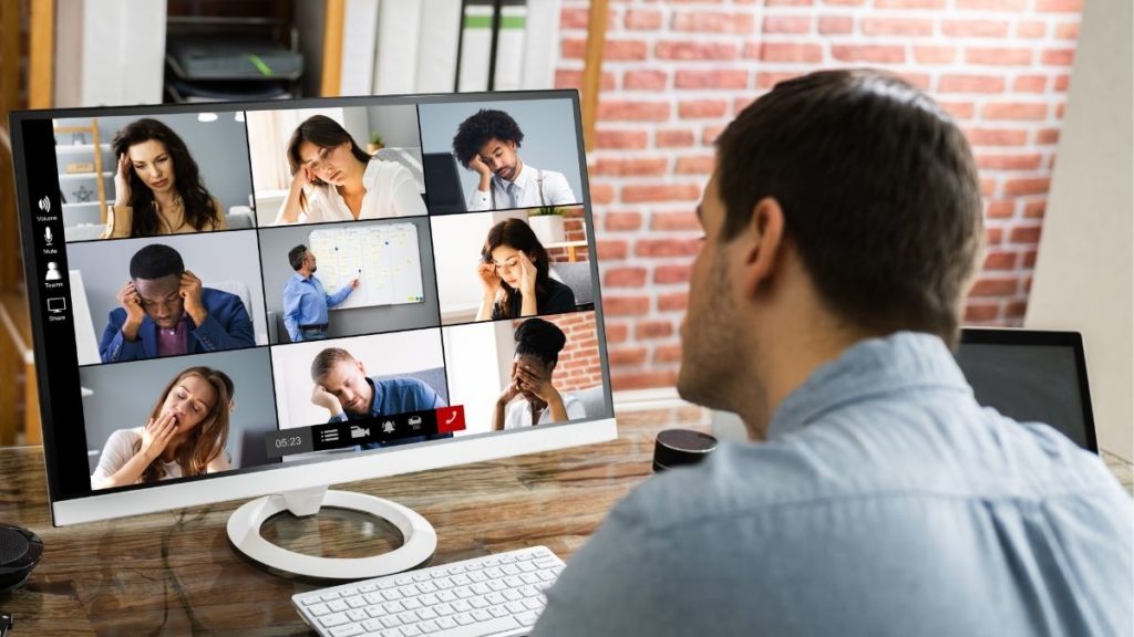 Person experiencing zoom fatigue while on video call